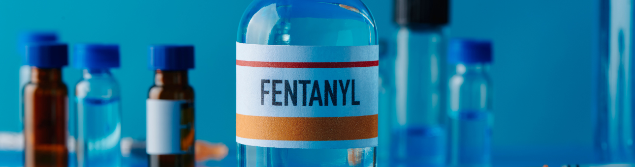 a bottle of fentanyl with other vials of it next to the bottle