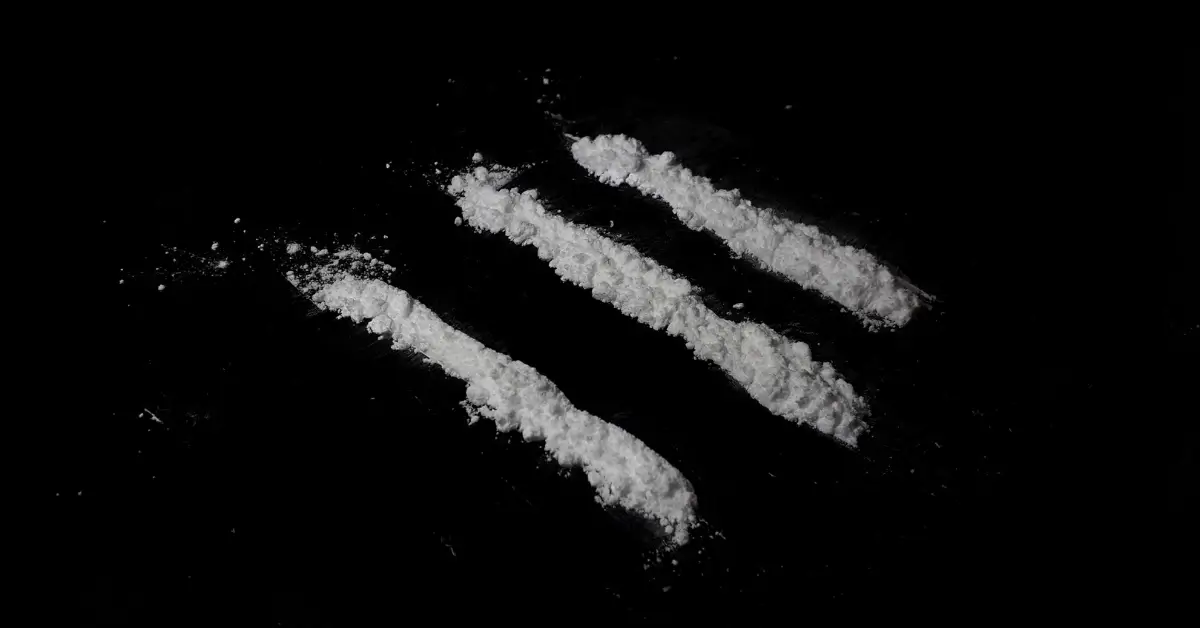 Powdered cocaine lines illustrating the public health risks of fentanyl being mixed into cocaine